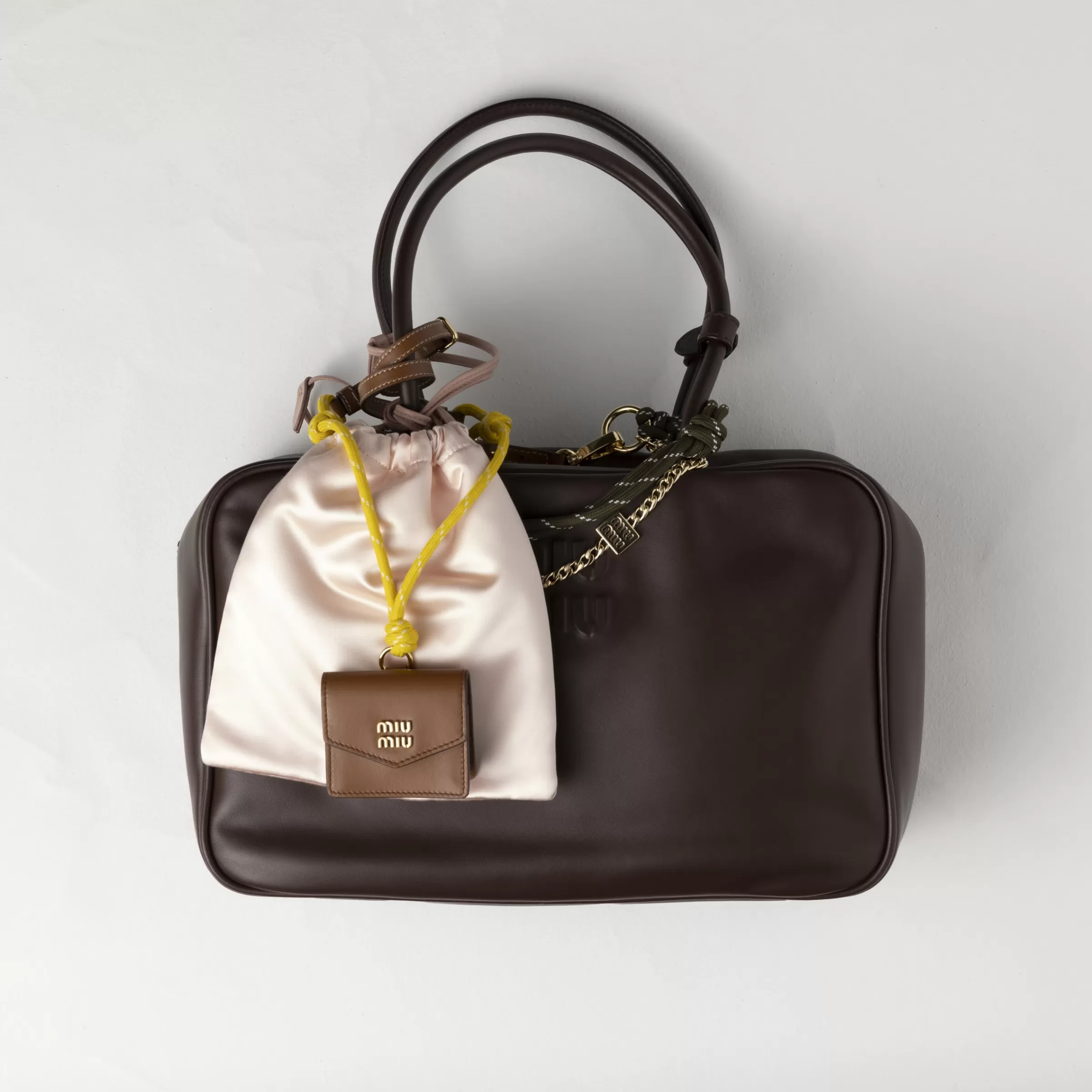 Leather, cord, and metal trick with mini-pouch>Miu Miu New