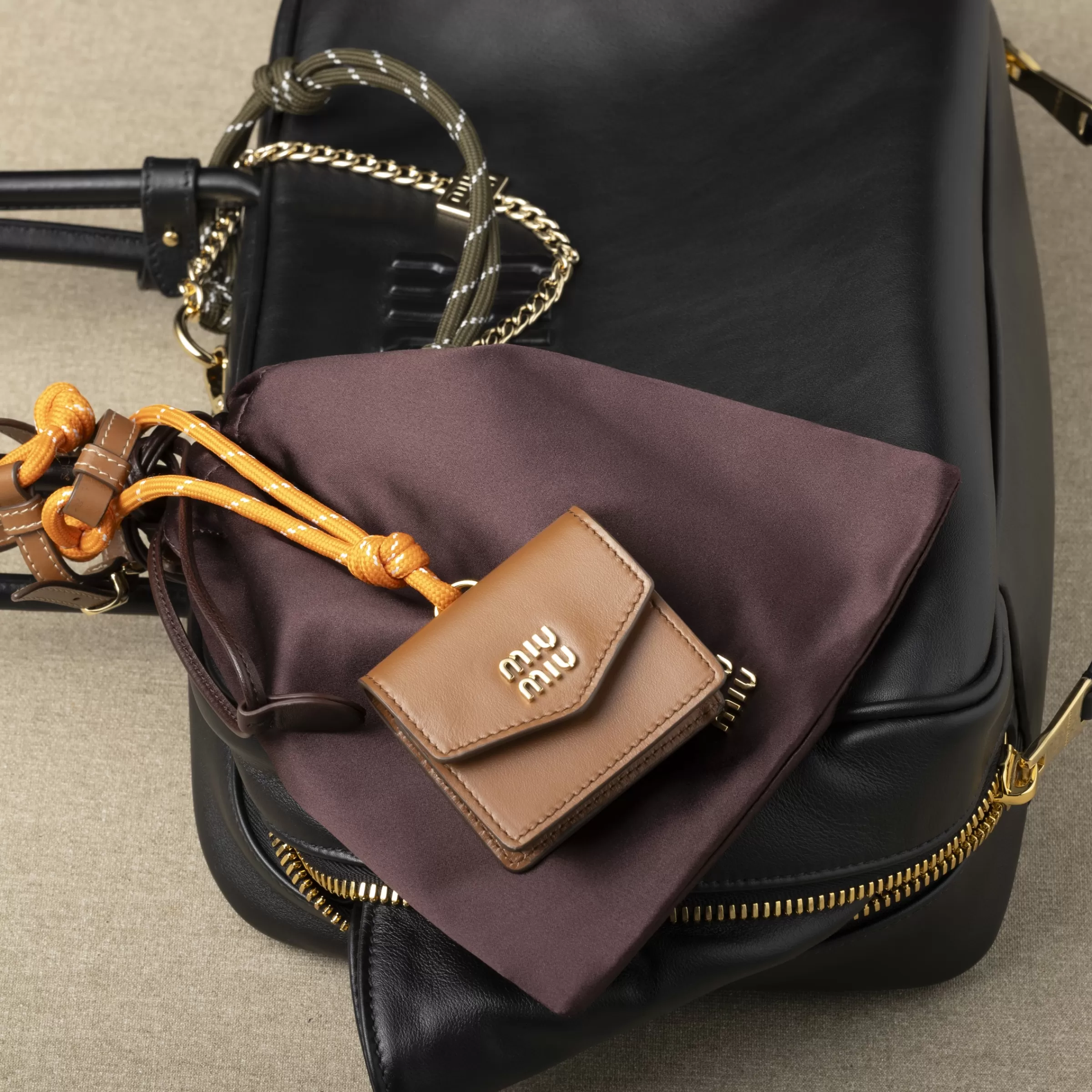 Leather, cord, and metal trick with mini-pouch>Miu Miu Hot