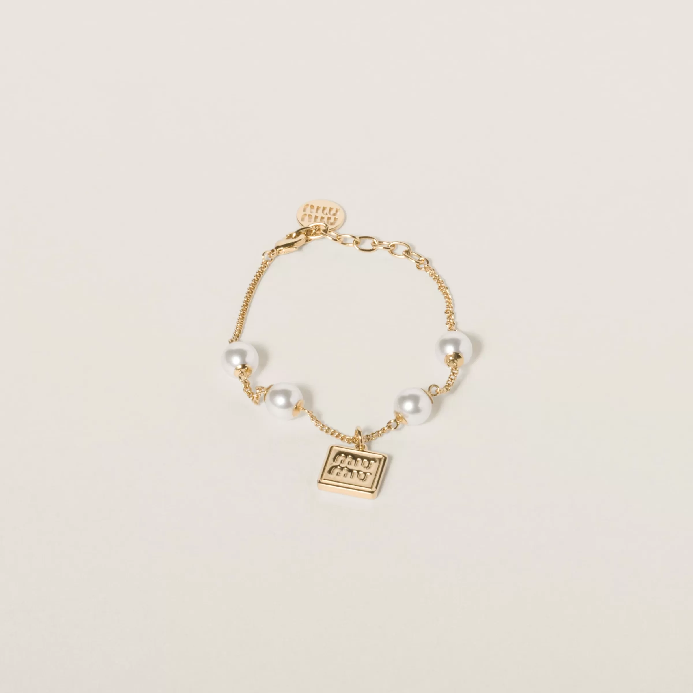 Metal bracelet with synthetic pearls>Miu Miu Shop